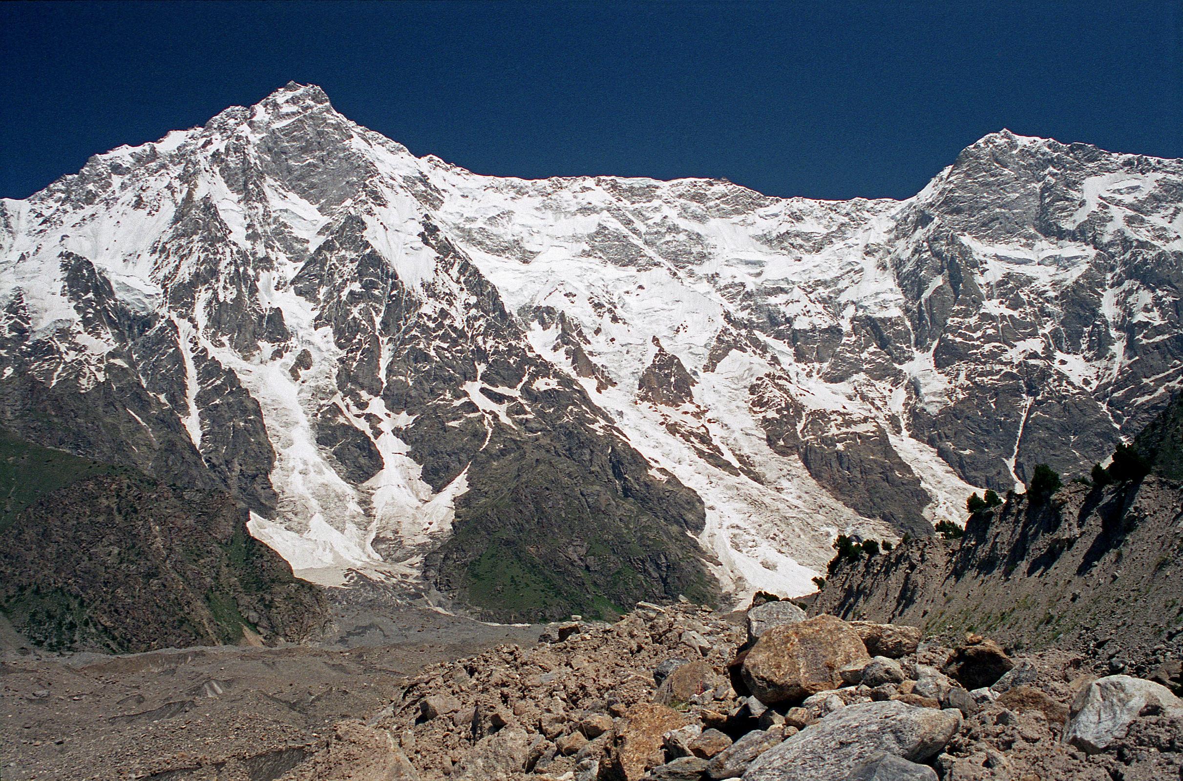 19 Nanga Parbat Rupal Face And Rakhiot Peak From Bazhin Glacier Just Past Rupal Face Base Camp We walked a little farther from Herligkoffer Base Camp (3656m) onto the Bazhin Glacier with the Nanga Parbat Rupal Face and the ridge to Rakhiot Peak towering above. Gunther Messner letter home June 15, 1970: To the north, directly above us, is the Rupal Flank  4500m to the summit. It is unbelievably impressive. (The Naked Mountain by Reinhold Messner)